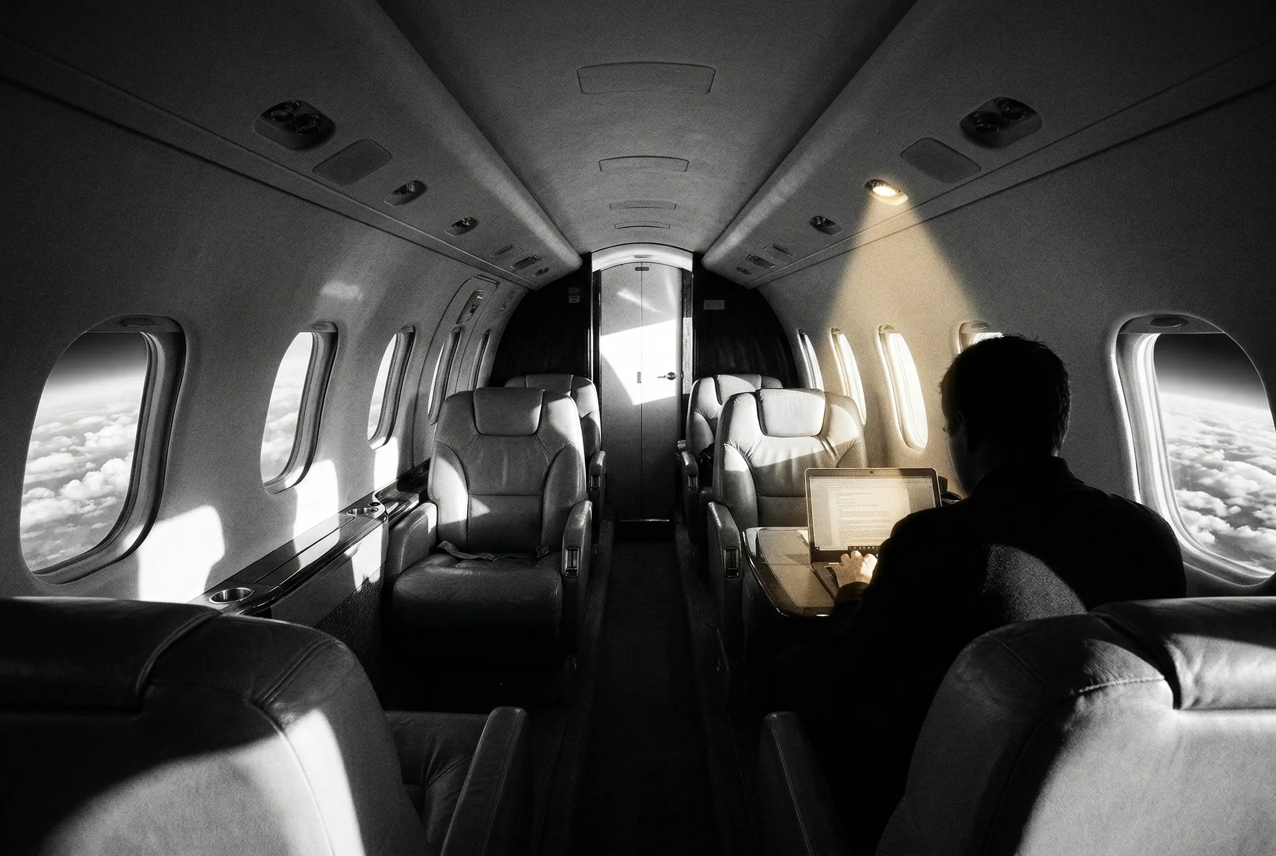 Learjet 60XR cabin interior with premium leather seating and polished wood accents